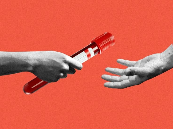 This may contain: two hands reaching out to each other with a red and white tube in the middle