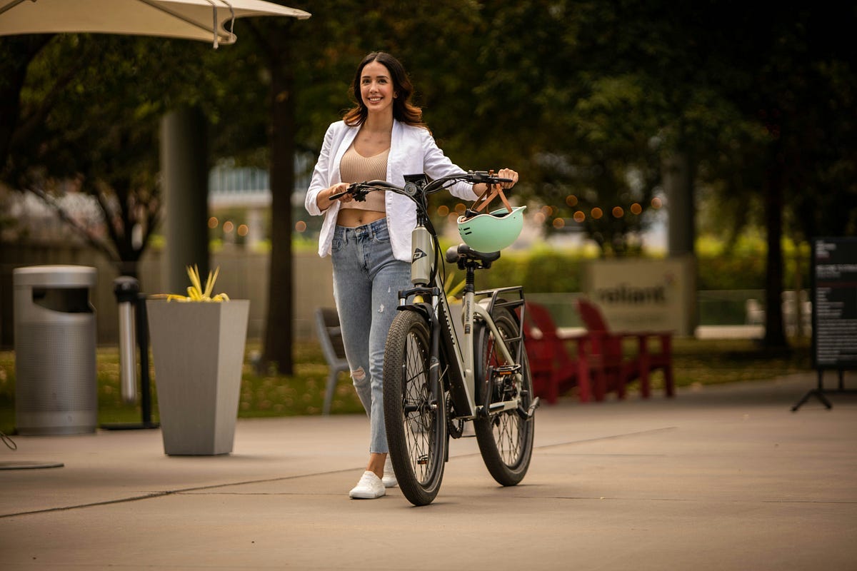 Smiling woman with a cycle. Smiling woman with a cycle.