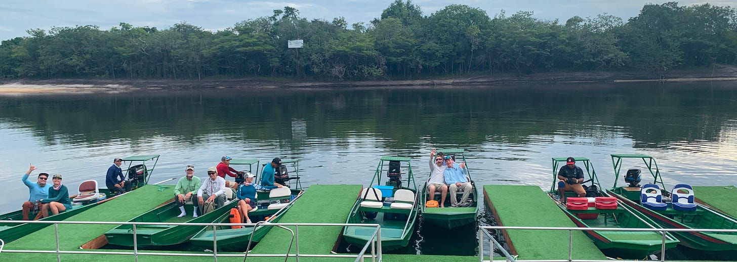 Boats at the Agua Boa Amazon Lodge in the morning with anglers going fishing for the day.