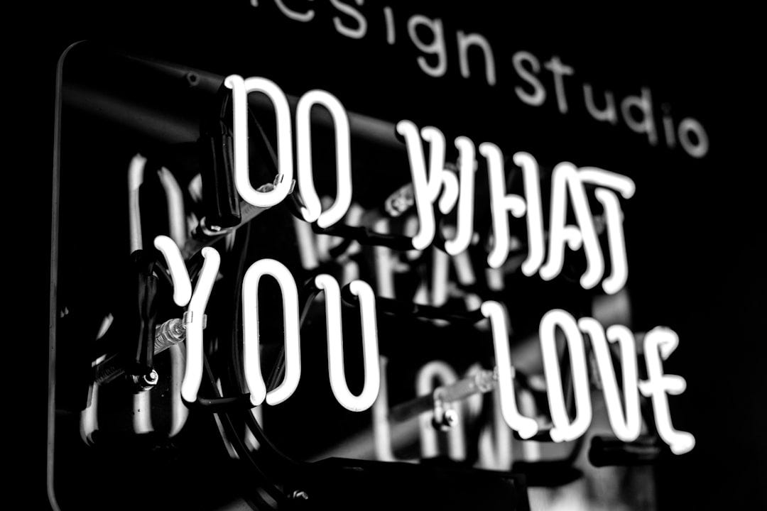greyscale photo of DO What YOu Love signage greyscale photo of DO What YOu Love signage