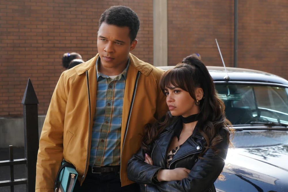Clay standing protectively with Toni