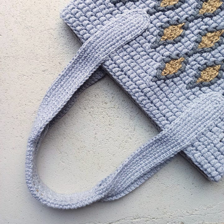Overlay mosaic crochet tote bag in greys and jute, and earthy toned samples.