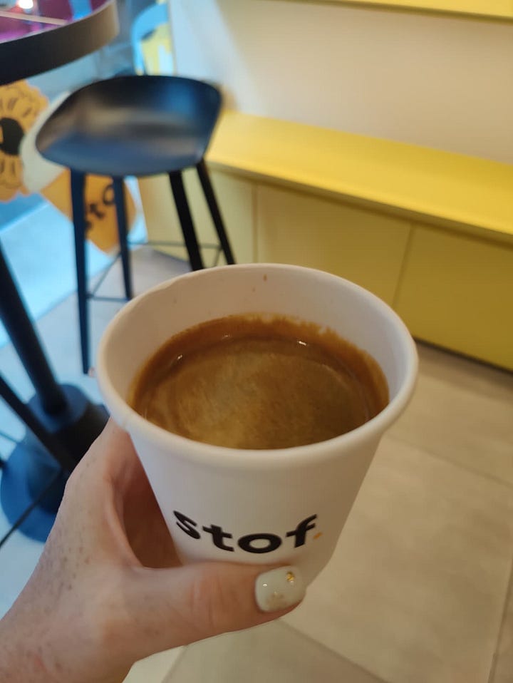 enjoying a hot Americano + empty cup