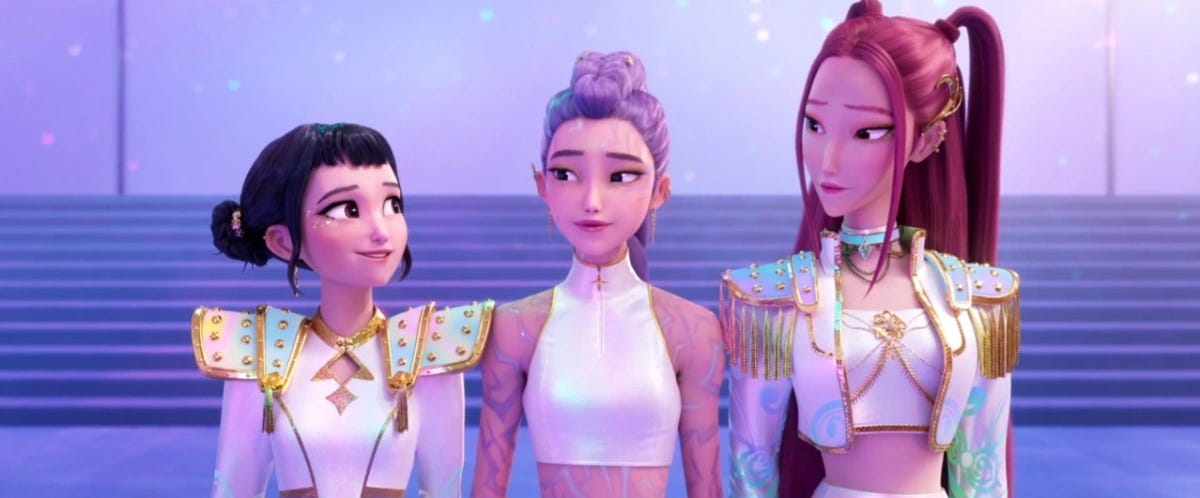 Zoey, Rumi and Mira stand together at the end of the film, smiling at each other, having saved the world. You can see the ghosts of Rumi's demon markings on her skin.