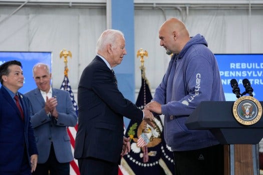 Sen. John Fetterman, D-Pa., shakes hands with President Joe Biden at the Philadelphia International Airport in Philadelphia, Saturday, June 17, 2023, after an aerial tour of the Interstate 95 highway collapse. Rep. Brendan Boyle, D-Pa., left, and Sen. Bob Casey, D-Pa., look on. (AP Photo/Manuel Balce Ceneta)
