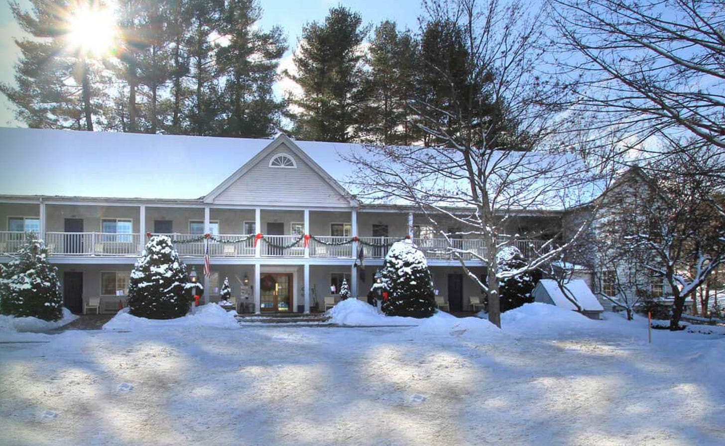 Photo of quaint hotel snow covered.