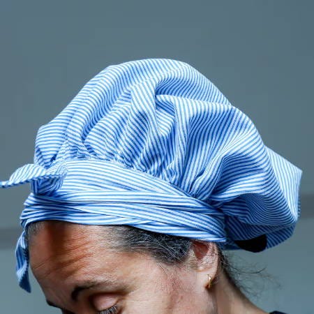 hair bonnet for sleeping on a women’s head side view, knot at the front hair bonnet for sleeping on a women’s head side view, knot at the front
