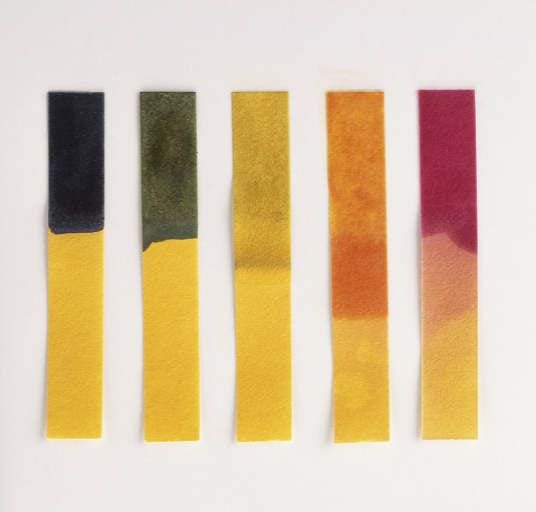 This may contain: four different colors of felt on a white surface with text that reads, what is paper?