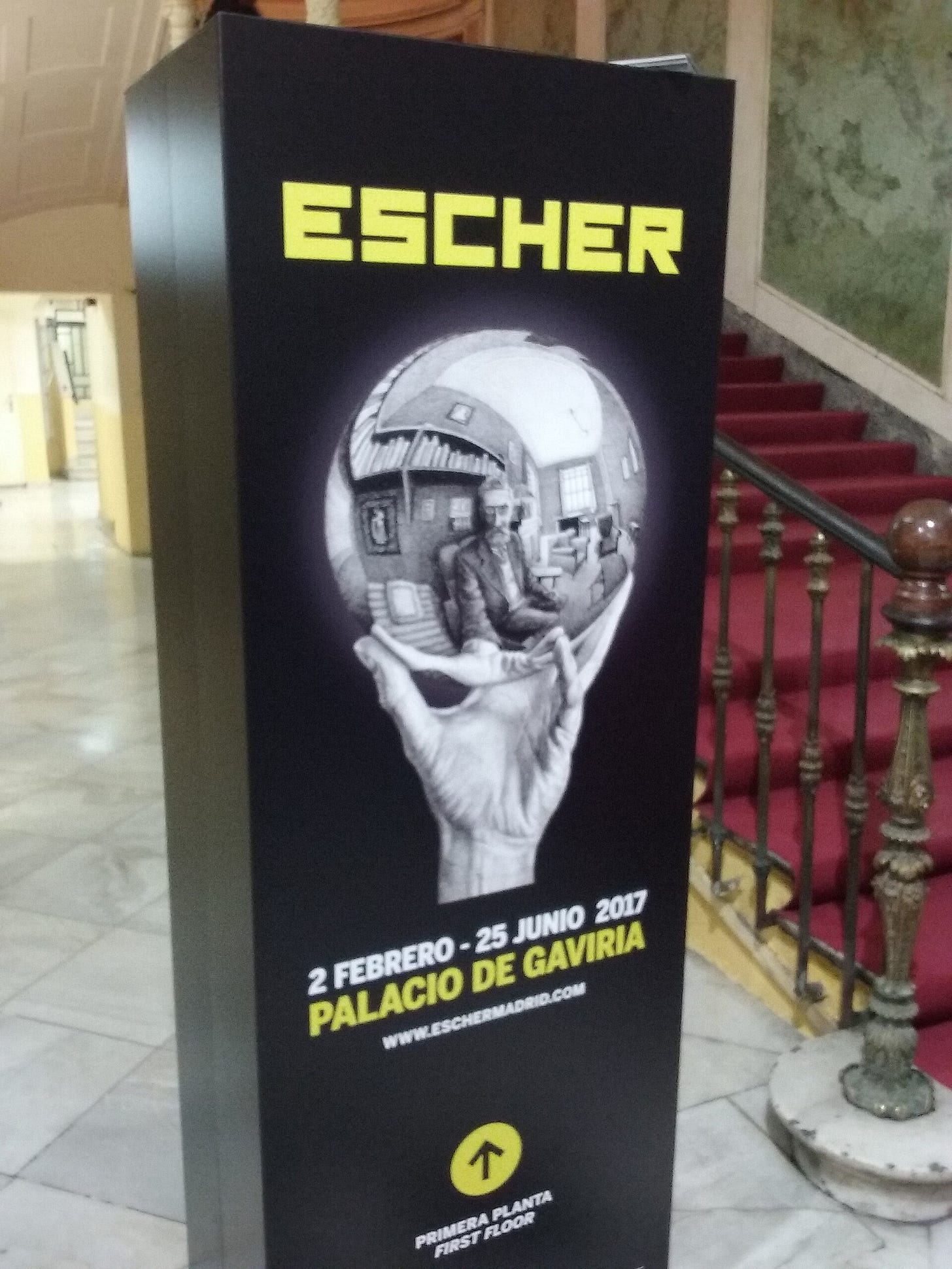 Escher hand holding a mirrored sphere