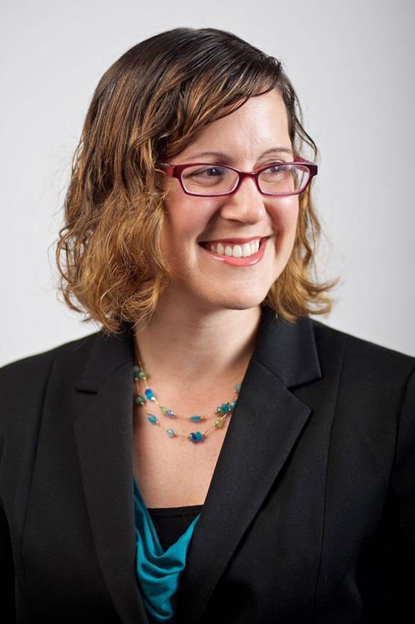 A person wearing glasses and a black jacket

AI-generated content may be incorrect.