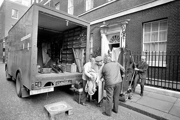 Mr. Edward Heaths baby grand piano is removed from No