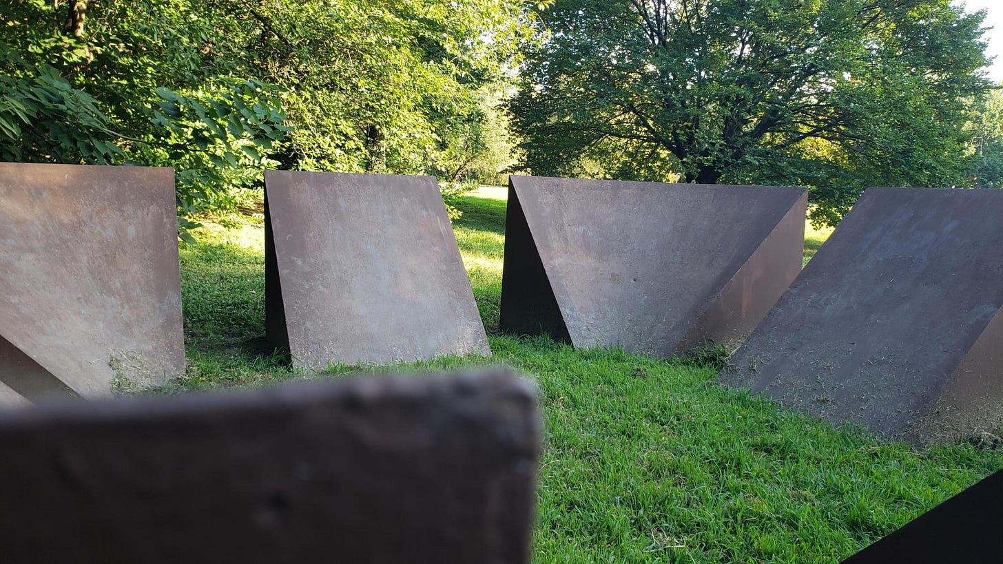 view from edge of this sort of brutalist, mysterious stone circle sculpture near the phila art museum