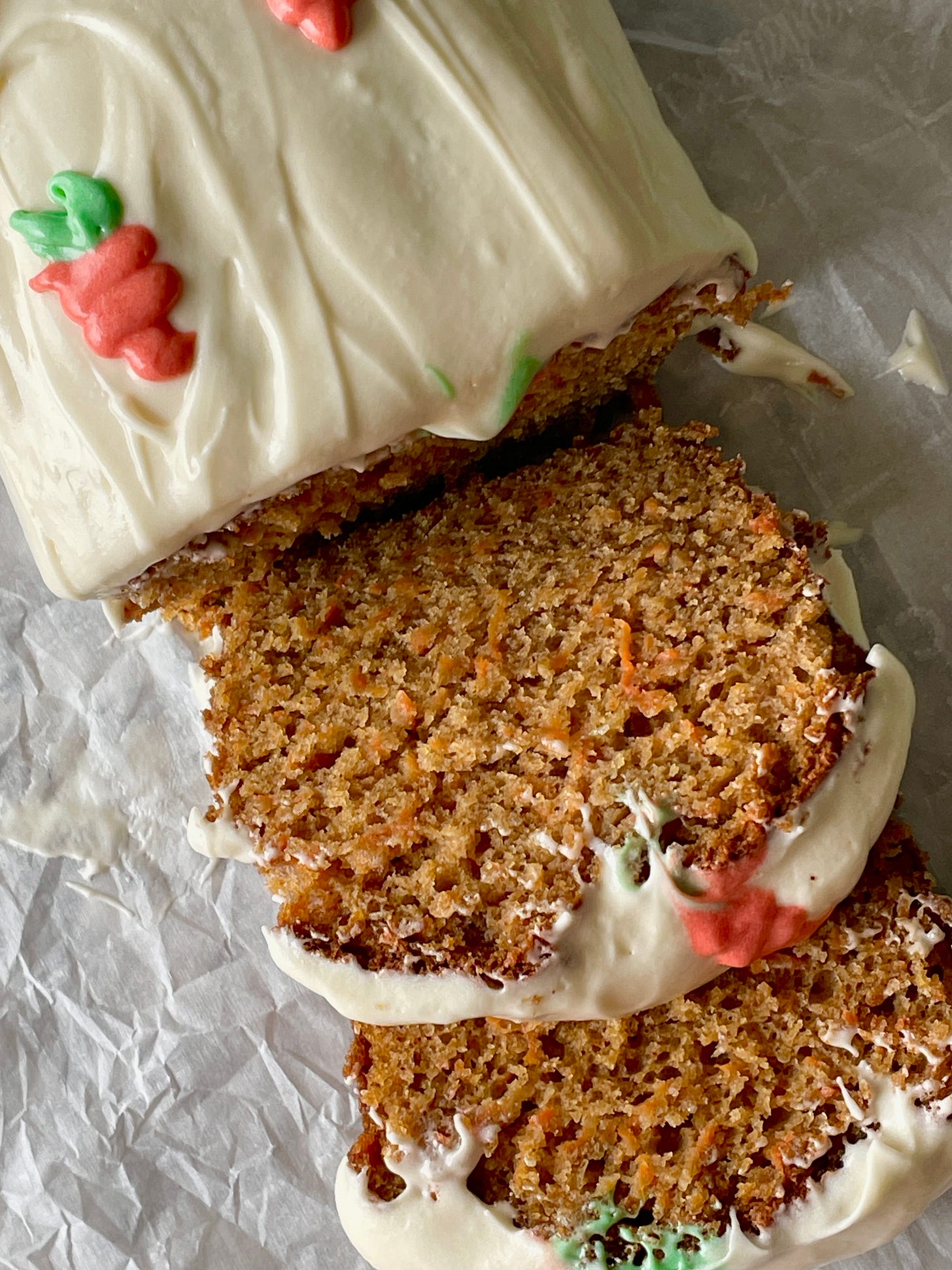 slice of carrot cake loaf with cream cheese frosting