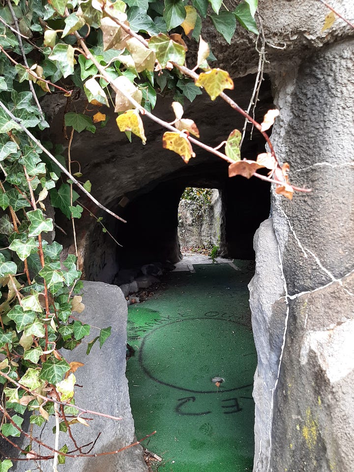 Vines hang down on what was once a cave at the miniature golf course.