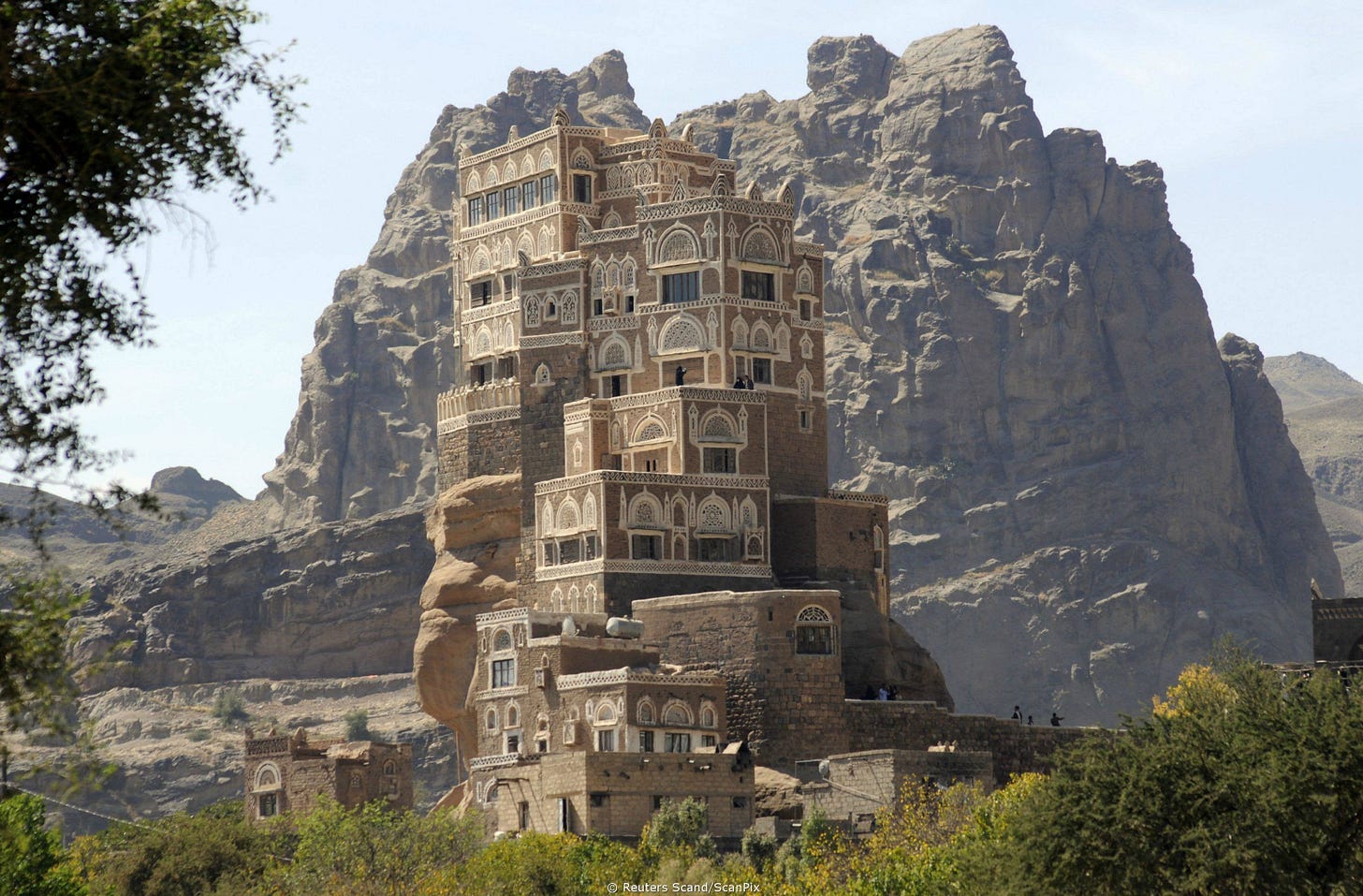Dar Al Hajar, Yemen. A Yemeni château, Dar Al Hajar (AKA: the rock palace)  was built over the ruins of an ancient building on top of a spire of rock.  I'll post