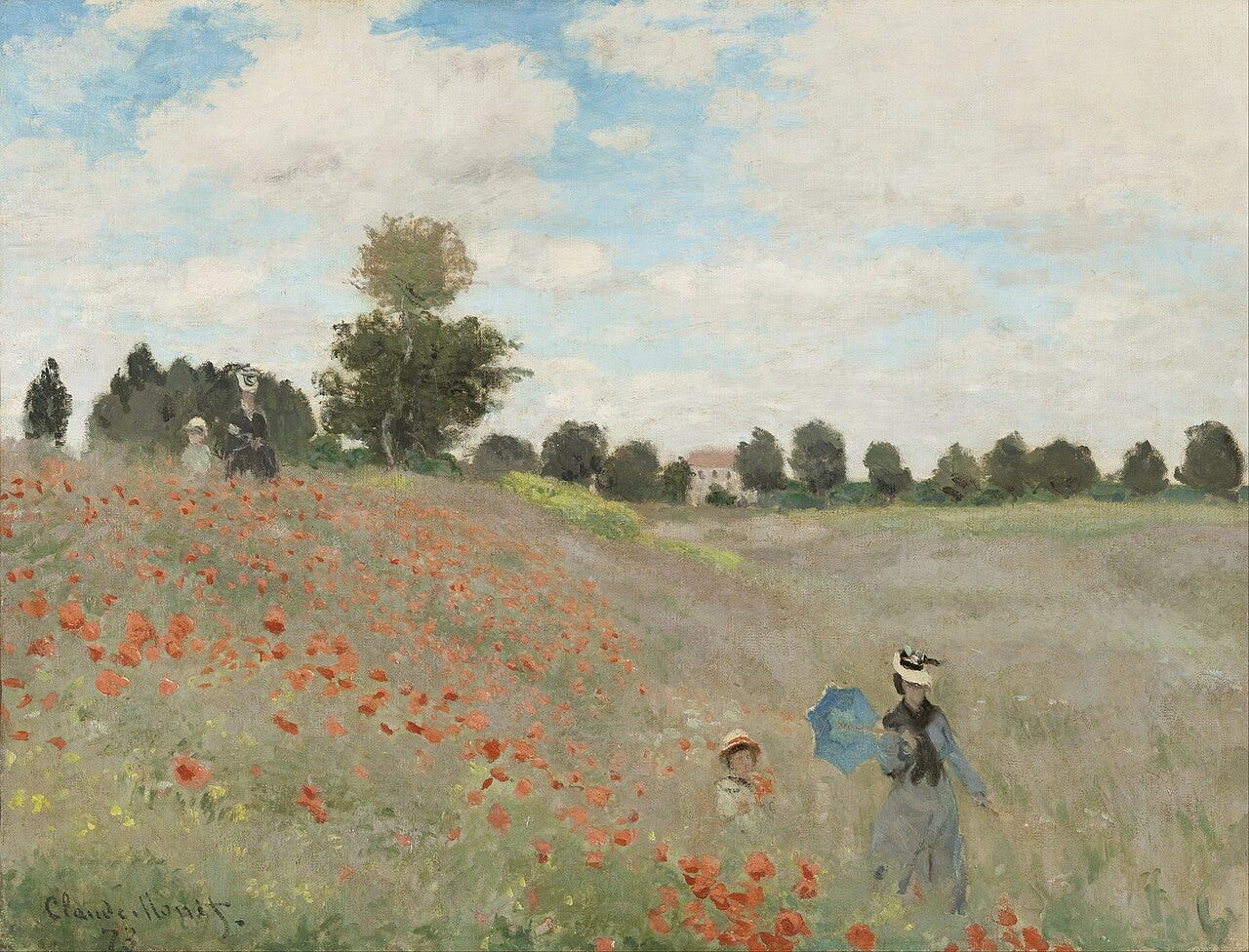 A slope of red poppies with a woman holding a blue parasol and a small boy in a straw hat walking through the tall grass