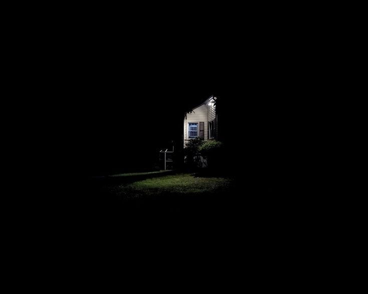 This may contain: a house is lit up at night in the dark