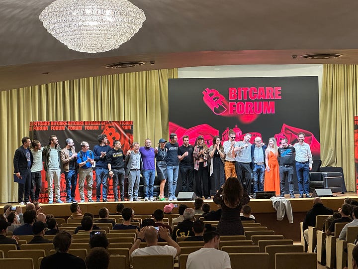A photo from outside of the conference building doors at BitCare Forum '25 (left) and a photo from the stage inside with the speakers after the conference ended (right)