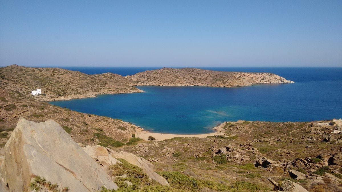 Getting to the quiet natural beach at Tris Klises requires a short hike—best to be accompanied by a... [+] friend.