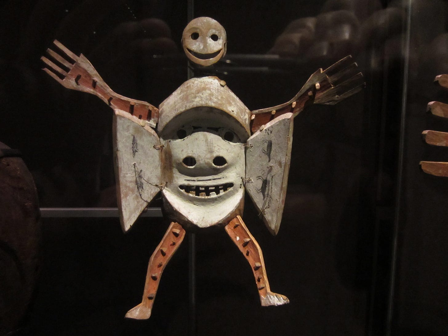 A metal sculpture of a person

Description automatically generated