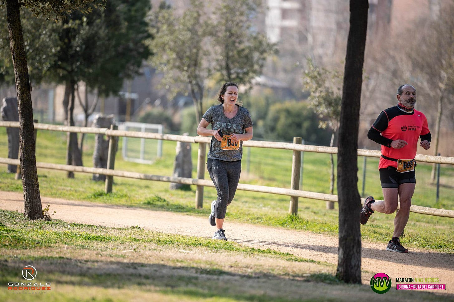 Me looking disgusting and panting, running behind a man in a pink shirt