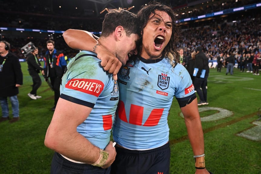 Jarome Luai and Mitchell Moses embrace after the Blues won State of Origin III. Jarome Luai and Mitchell Moses embrace after the Blues won State of Origin III.