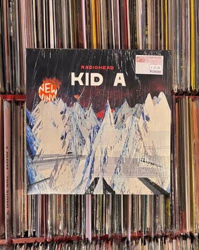 Radiohead's "Kid A" was released on October 2, 2000. Drawing on IDM,  Krautrock, and abstract hip-hop, it marked an pivot into electronic  experimentation. “Idioteque” glitches, while “The National Anthem”  smoulders.