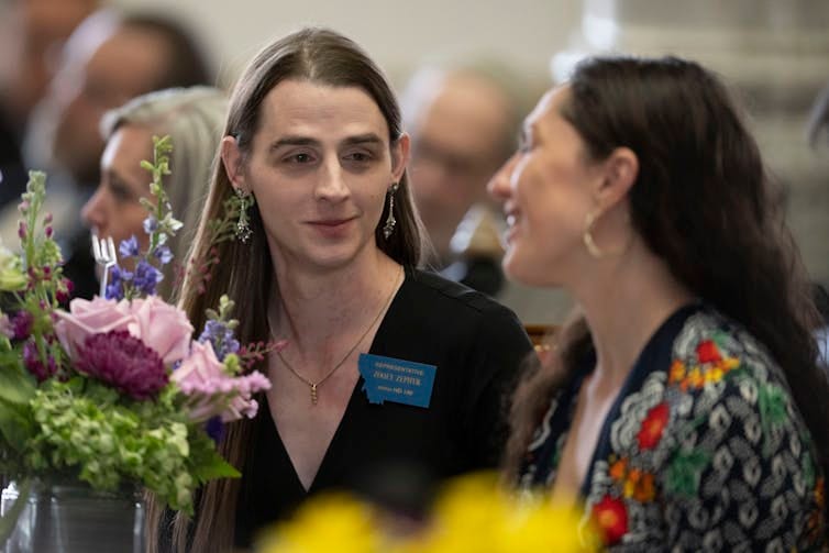 two women speaking to each other two women speaking to each other