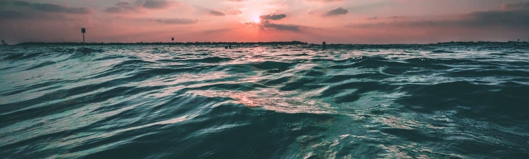 body of water during golden hour body of water during golden hour