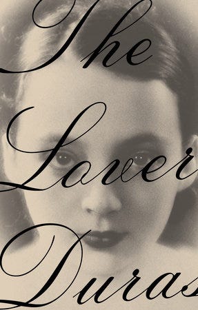 The book cover of The Love with a black and white photo of the author as a young woman in lipstick.