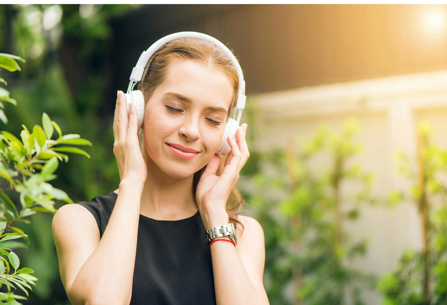 person listening to music with headphoned