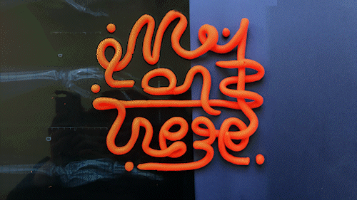 A gif of an animated phrase made of clay "Montrez-Moi" or "show Me" on a paper and xray background.