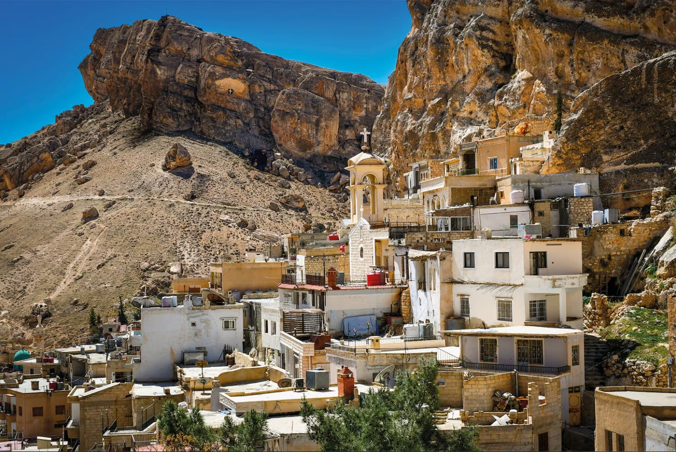 Maaloula, Syria — one of the last Christian villages on earth where Aramaic, the mother tongue of Jesus, still survives. In these mountains, Christianity is not archaeology or tourism. It is a living language, a living people, and a sacred memory now threatened by the same regional fragmentation tearing the ancient Christian East apart.