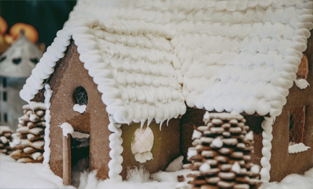 a gingerbread house with a snowman
