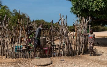 A group of boys drawing water from a community well in the village of Eticoga on the island of Orango in the Bissagos archipelago A group of boys drawing water from a community well in the village of Eticoga on the island of Orango in the Bissagos archipelago