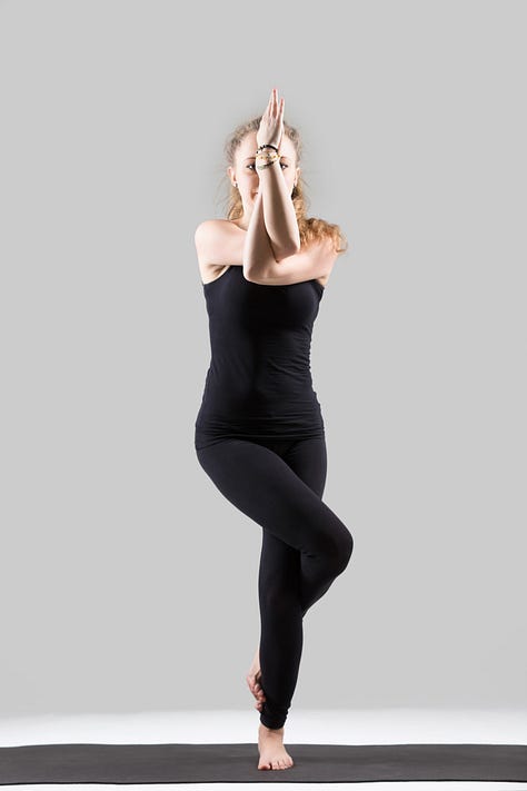 Yound women doing yoga poses like twist and eagle pose