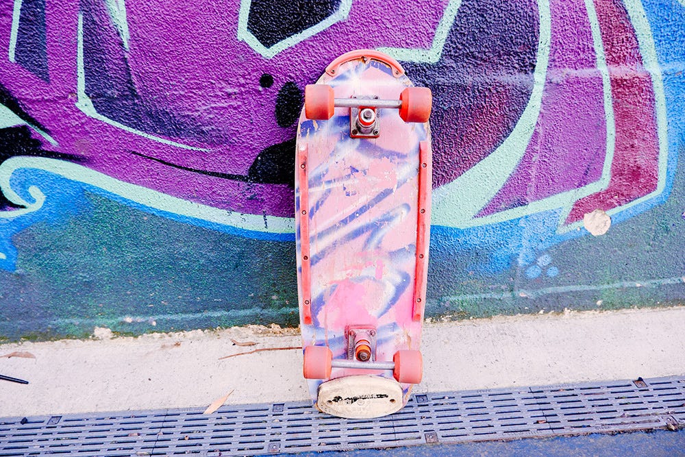 skateboard against a graffiti wall skateboard against a graffiti wall