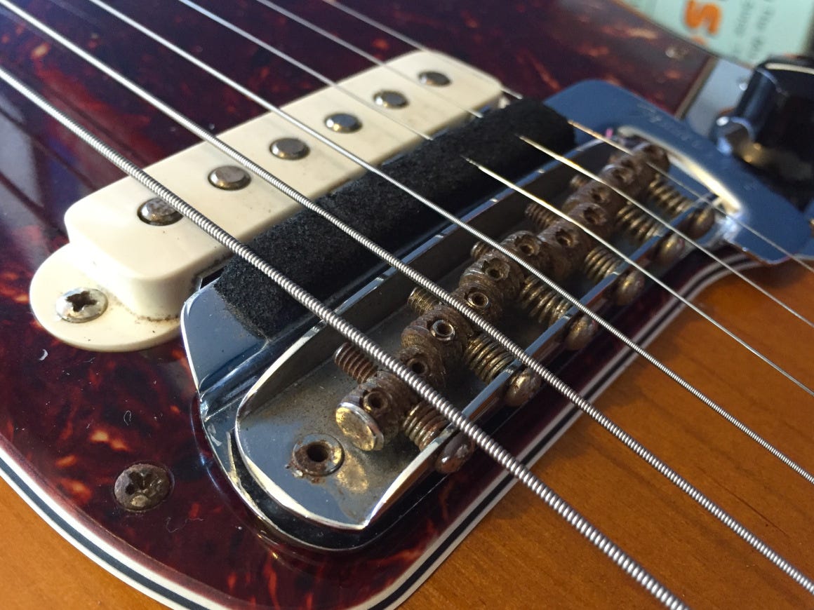 A close-up of a guitar with a pickup, capturing the intricate details of the instrument's design and technology.