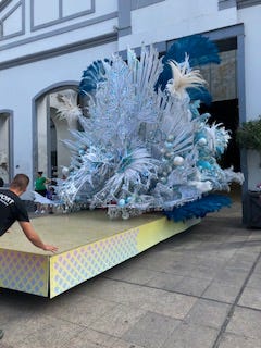 beautiful, feathered floats in shimmering colours that are too big for the warehouse doors