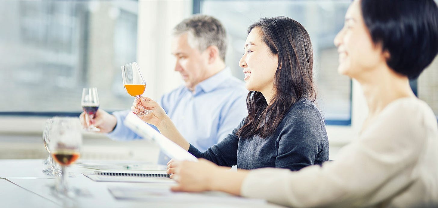 WSET student tasting an orange wine