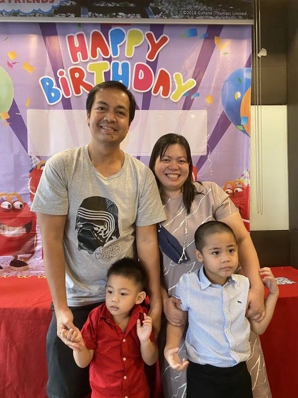 Family photo during Miguel and Rafa's first Christmas party at McDonald's Belfast Family photo during Miguel and Rafa's first Christmas party at McDonald's Belfast