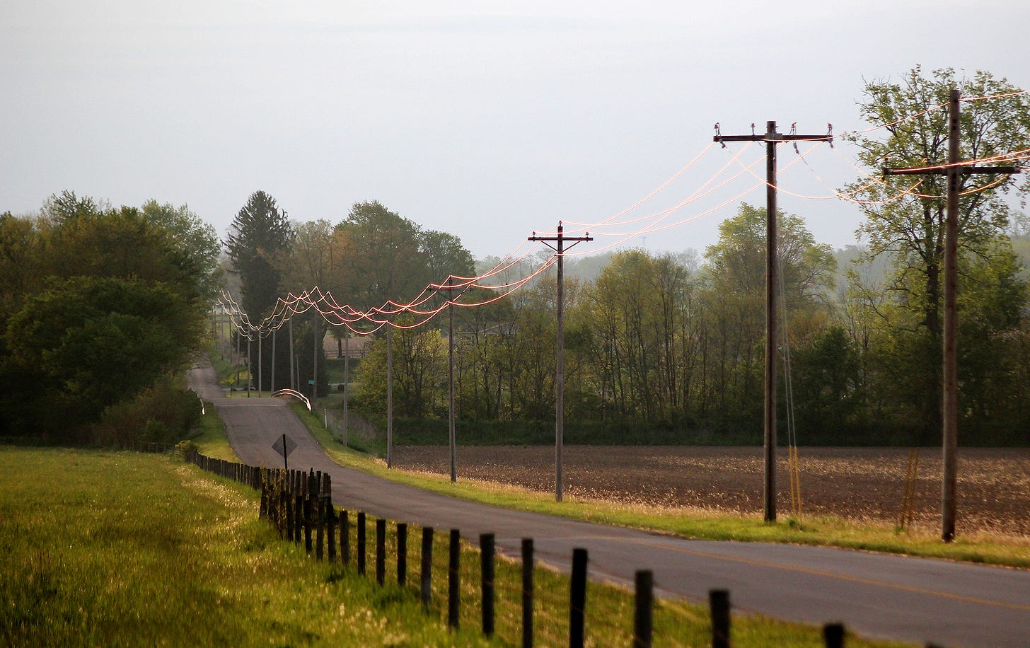 Sunrise offers its own opportunities. Unimpressive in most its other attributes, this photo caught an interesting play of light on power lines.