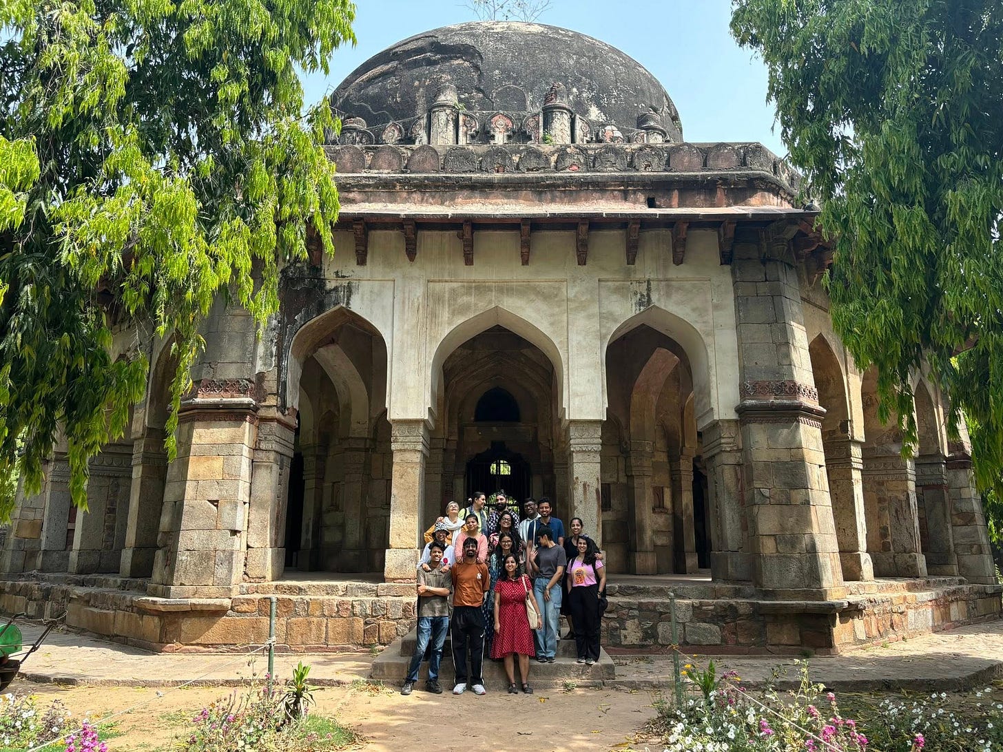 May be an image of 5 people and monument