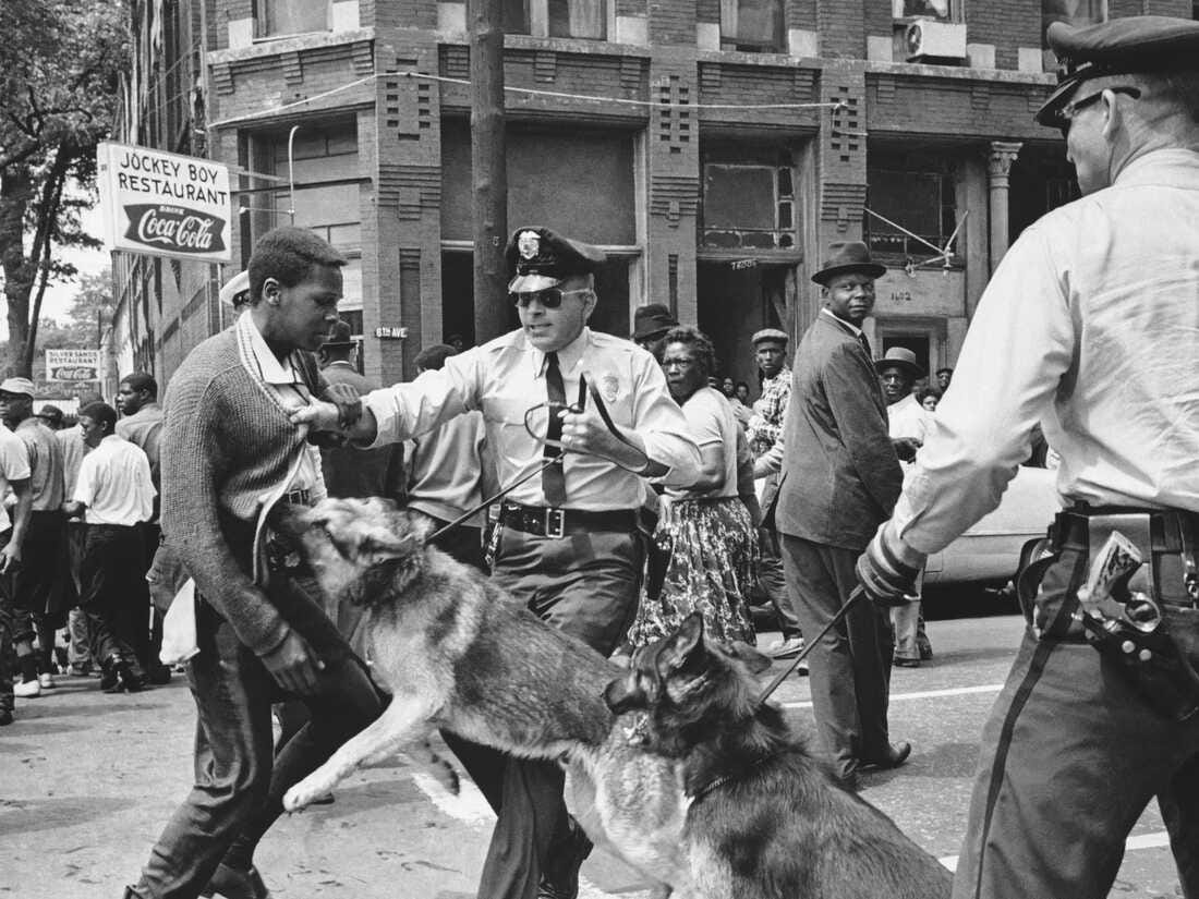 A 17-year-old Civil Rights demonstrator is attacked by a police dog in Birmingham, Ala., on May 3, 1963. This image led the front page of the next day's New York Times.