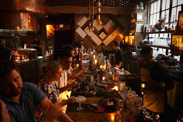 Shared meal and Street Food Cart. Photos by Nguy n hi p and Brett Wharton via Unsplash.