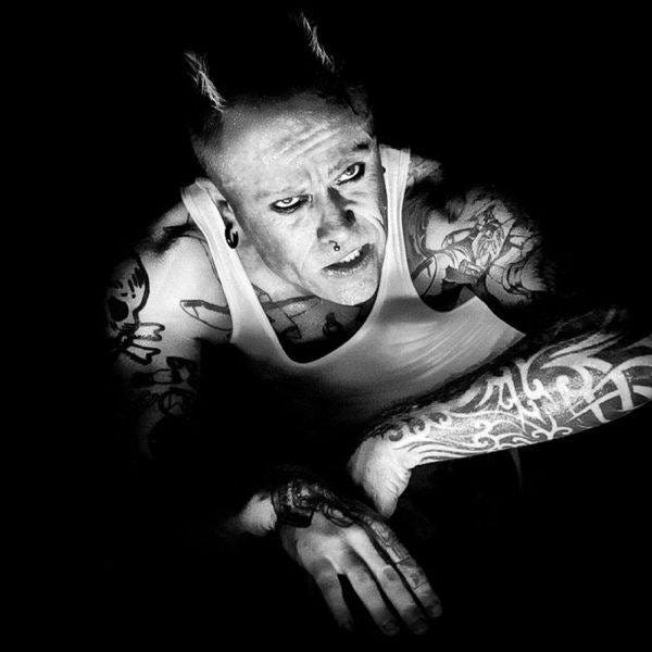 Keith Flint of Prodigy looking up with horns. Keith Flint of Prodigy looking up with horns.