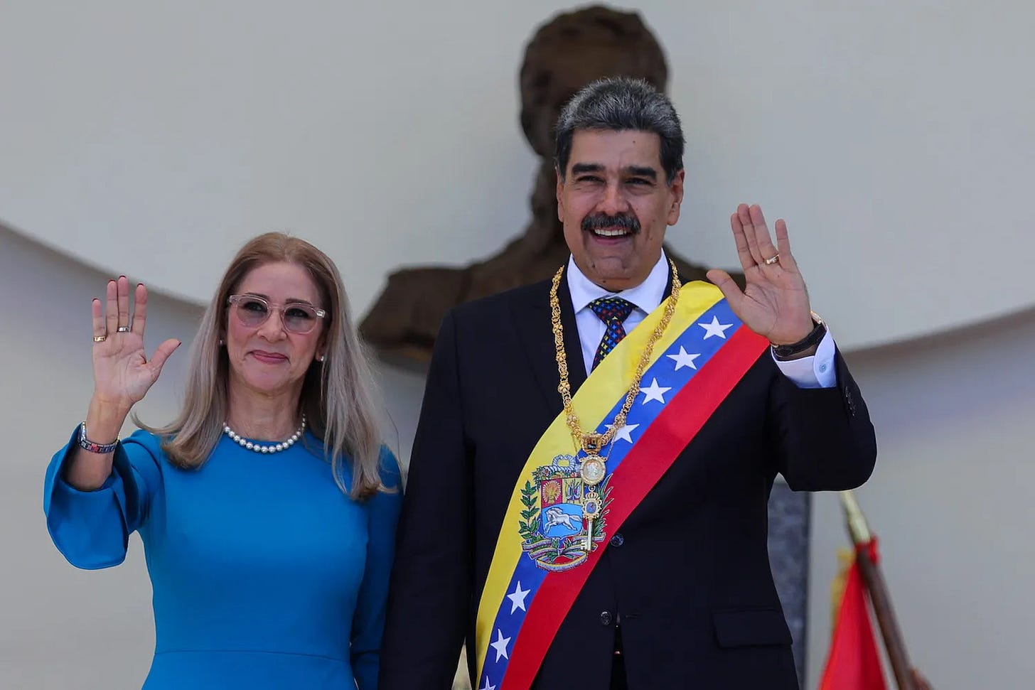 Venezuelan President Nicolás Maduro and his wife, Cilia Flores, pose for photos after the inauguration ceremony in Caracas.