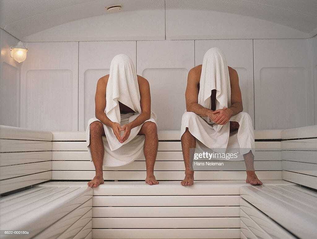 Two Men Sitting in Sauna Two Men Sitting in Sauna