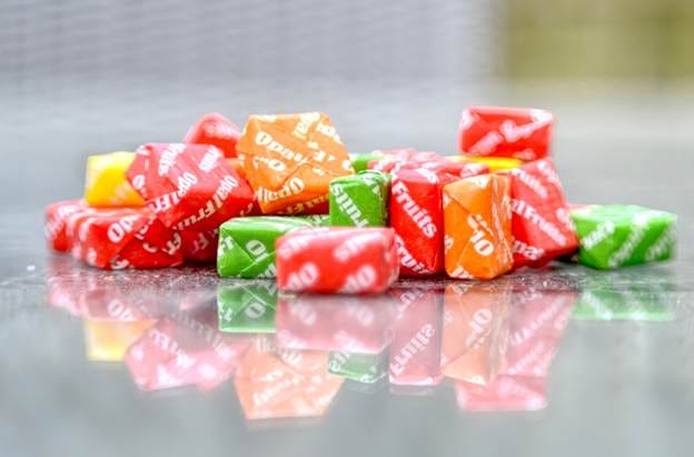 A group of colorful square candies

AI-generated content may be incorrect.