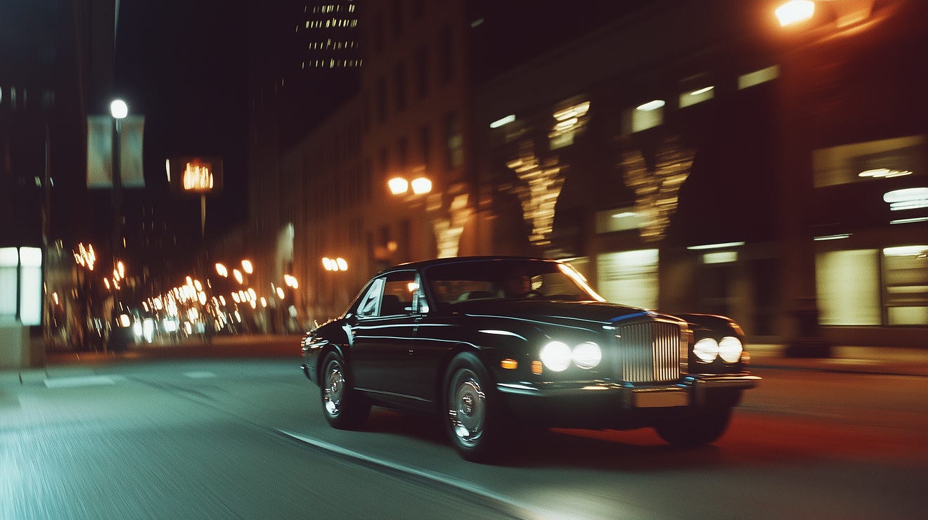 “Classic black luxury car driving through a bustling city street at night, its headlights illuminating the road. Motion blur emphasizes speed and sophistication, while the urban skyline with tall buildings and streetlights enhances the scene’s dynamic energy. Perfect for showcasing timeless elegance and high-end automotive design in a modern city setting.